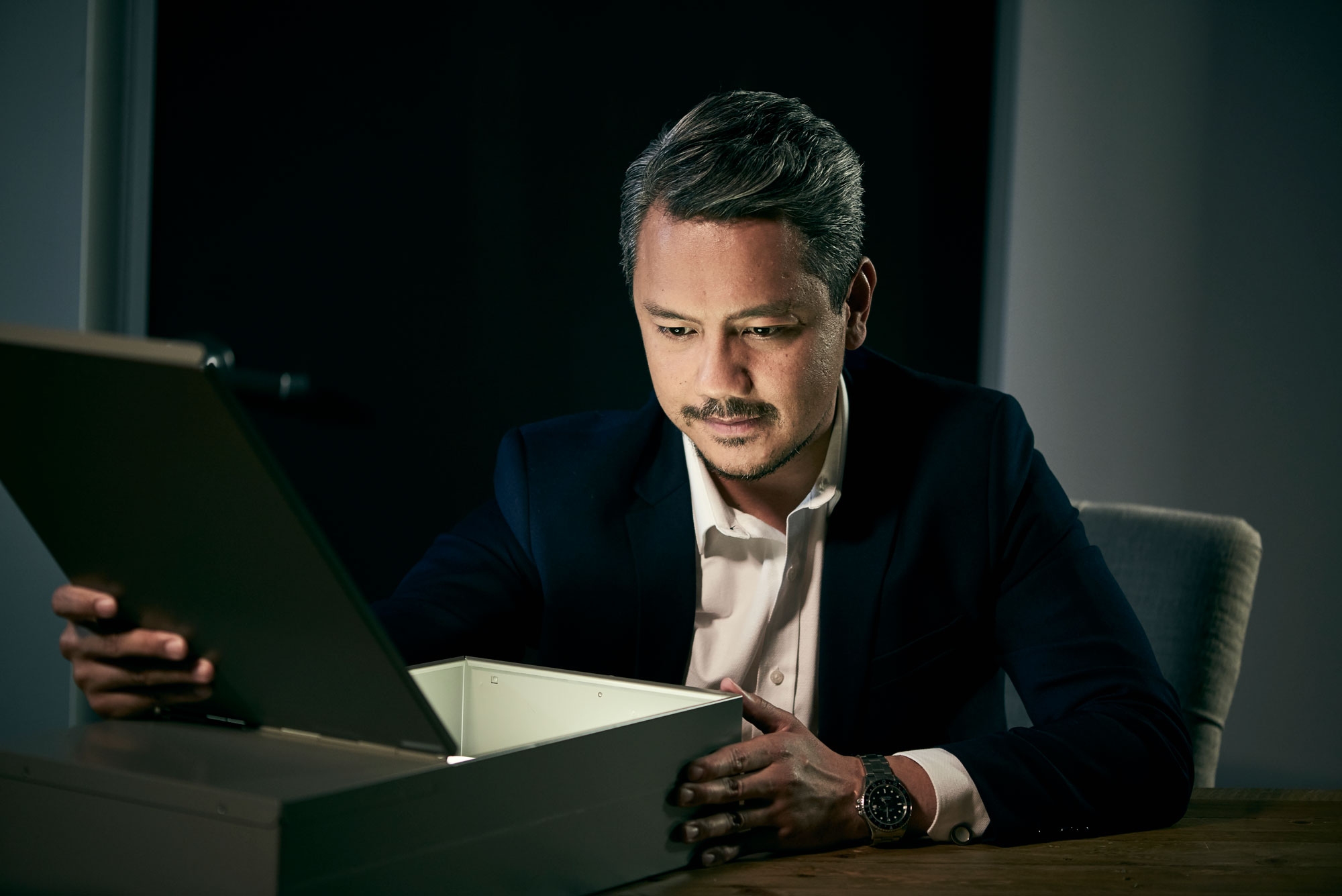 man opening safe deposit box